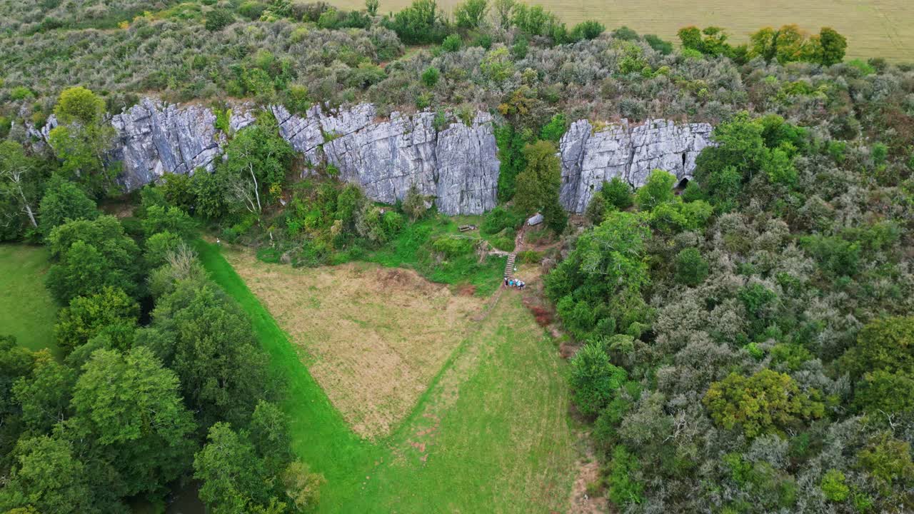 Caves of Saulges, Grotte Rochefort prehistoric and geological site in Saint-Pierre-sur-Erve, Mayenne in France. Aerial top-down orbiting