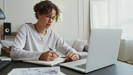 young man studying online