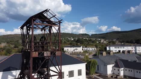 Ancient-mine-tower-and-buildings-of-an-underground-coal-mine-called-Pozo-Julia-in-Fabero-Aerial-view-6