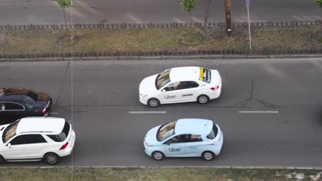 luxury cars and vehicles traveling at two lane highway in kyiv, ukraine