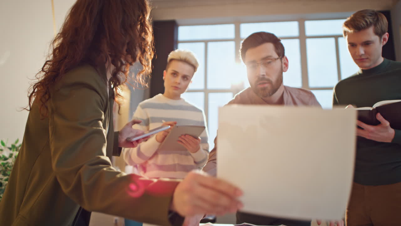 Team coworkers brainstorming office conference room. Colleagues discussing work
