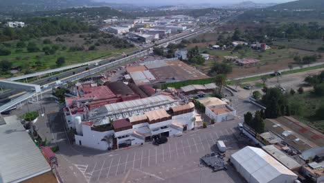 Perfect-aerial-view-flight-bird's-eye-view-drone
of-ibiza-discotheque-at-daytime-summer-2022