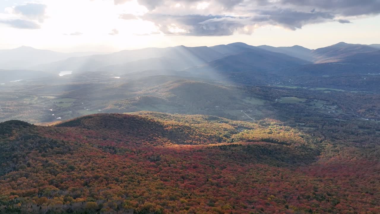 aerial push toward mount mansfield near stowe vermont in fall with autumn leaf color in new england