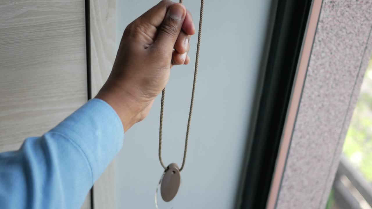 Hand holding a necklace