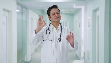 happy indian doctor showing okay sign