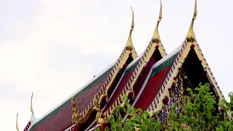 ornate temple roof tiles at wat arun in bangkok, thailand