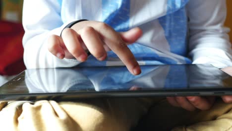 young boy using a tablet