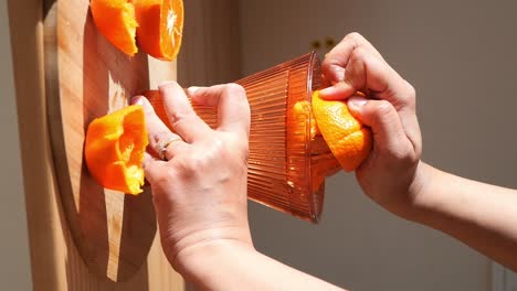 squeezing oranges for juice