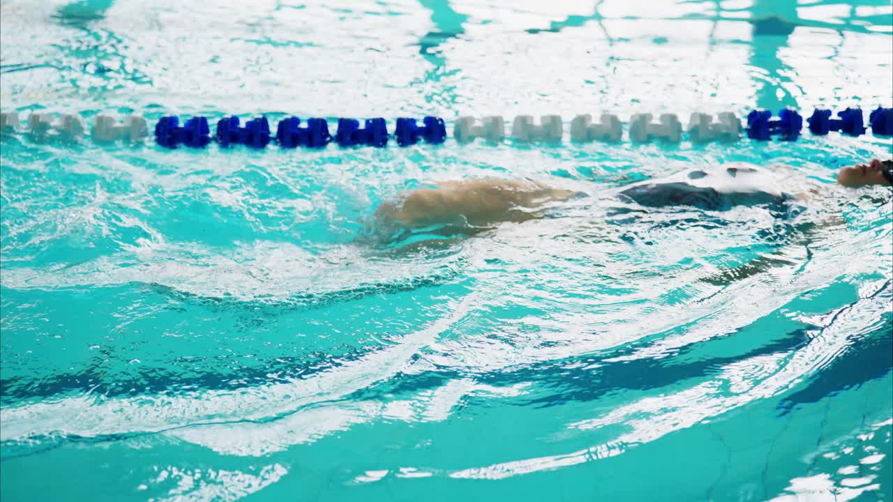 A Tranquil Swimming Pool Scene with Reflections and Vibrant Blue Water Evoking Serenity and Sport, Ideal for Swim Training and Relaxation