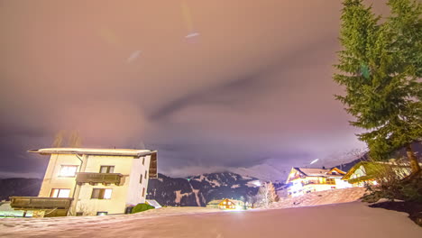 Milky-Way-Galaxy-spin-above-snow-covered-rural-town,-fusion-time-lapse