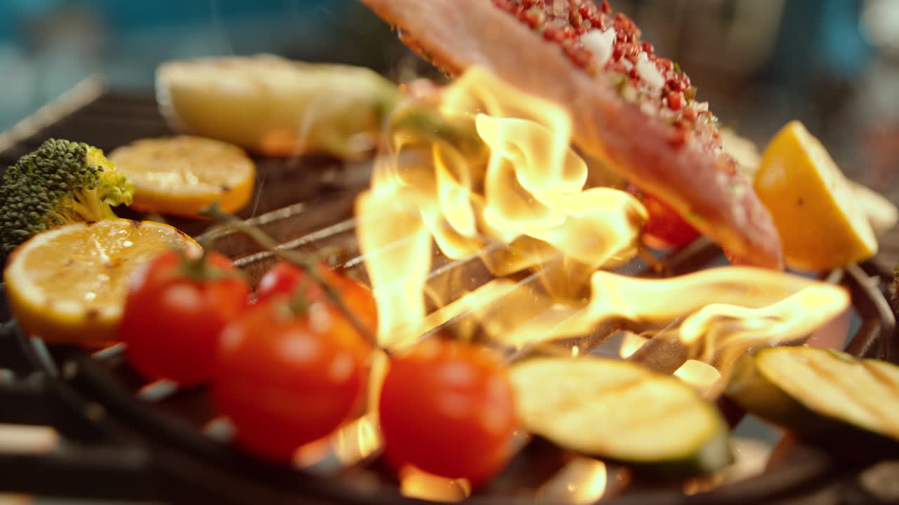 Flaming Steak and Vegetables on a Grill