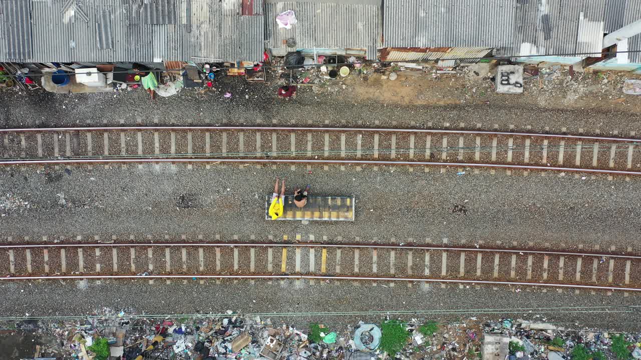 Train Tracks Running Through a Shanty Town