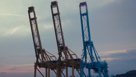 port cranes at sunset
