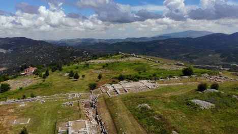 Archaeological-site-of-ancient-city-of-Bylis-with-ruined-stone-buildings-on-hill-seen-from-above