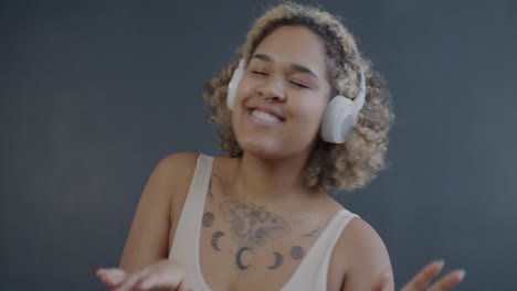woman dancing with headphones