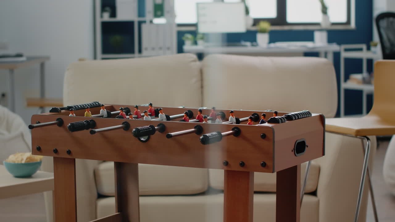 Nobody in workplace with foosball table for soccer game