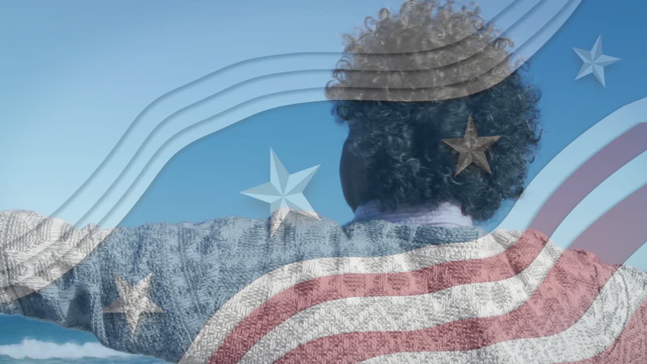 Facing sky, curly-haired person with American flag animation overlay and stars