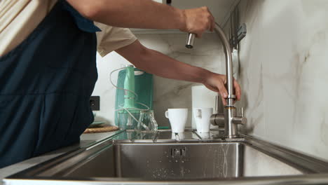 plumber fixing faucet