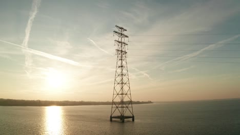 high voltage line tower on a sunny evening