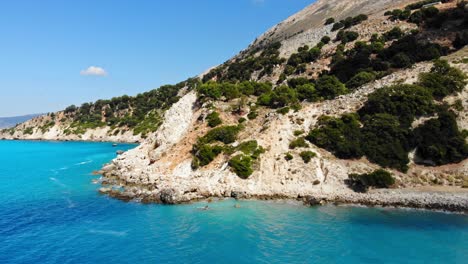 beautiful and crystal clear waters of agia kiriaki beach in kefalonia greece - aerial dolly shot