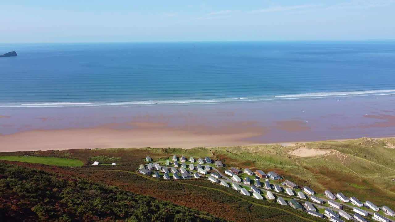 Aerial View of a Coastal Holiday Park with Beach and Ocean