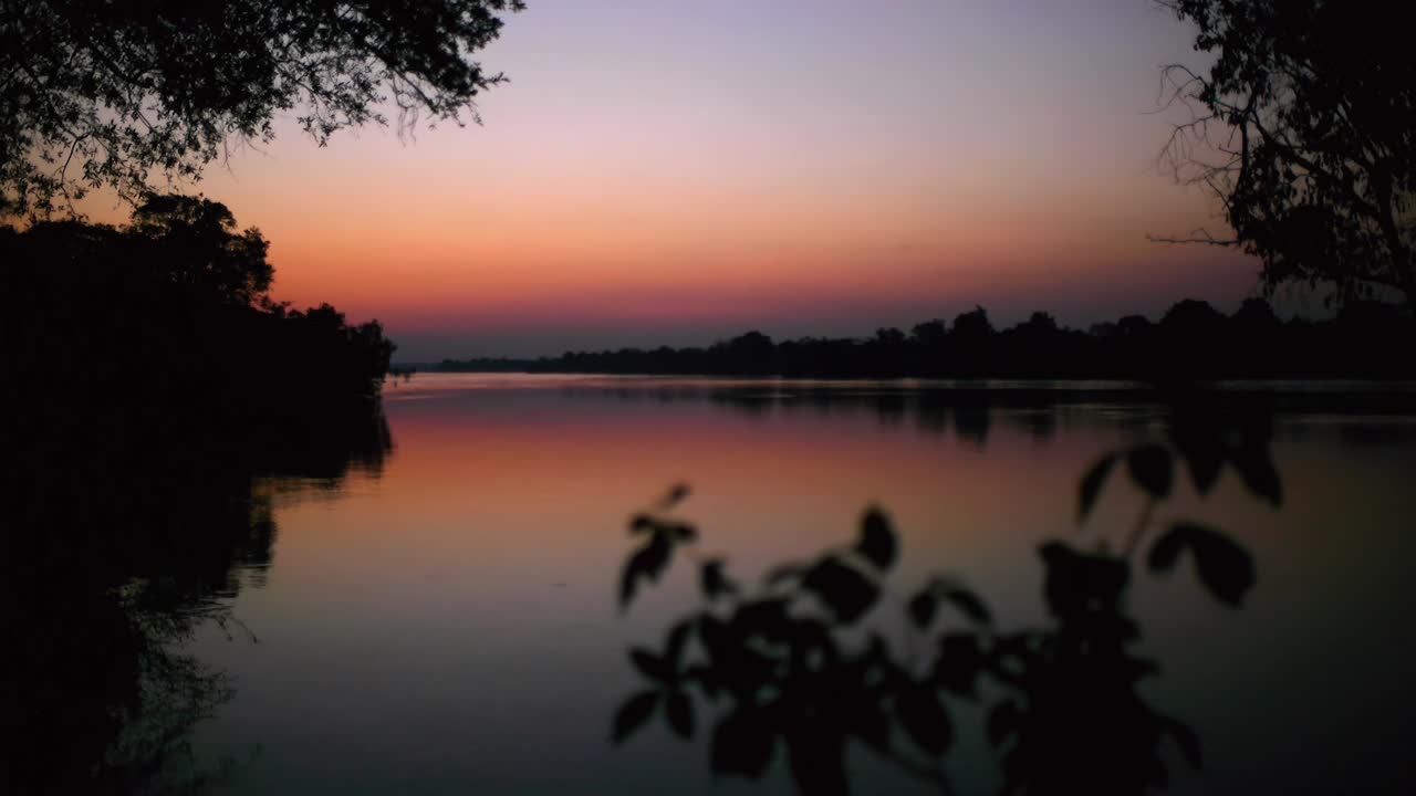 Zambia's Kafue River painted in evening purples and pinks