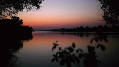 zambia's kafue river painted in evening purples and pinks