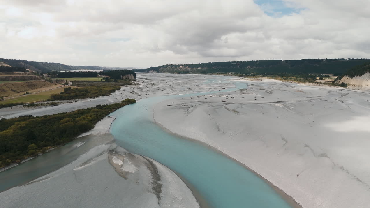 Aerial View of a Turquoise River and Dry Riverbed in New Zealand