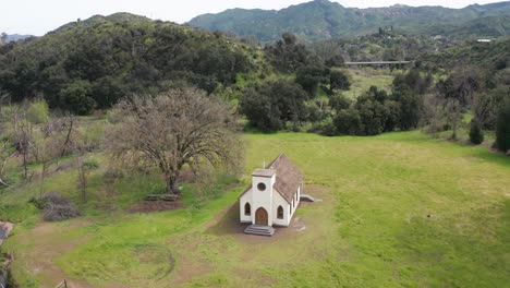 close-up panning aerial shot of the surviving church from the 2018 woolsey fire that destroyed the historic paramount ranch movie backlot in agoura hills, california