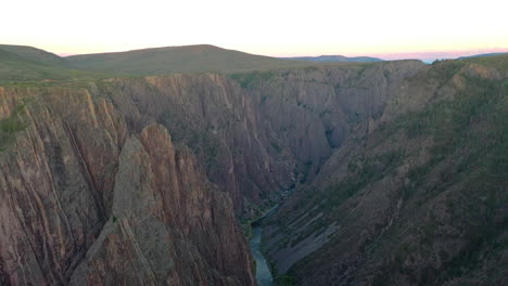 Aerial-Drone-Footage,-the-Black-Canyon-of-the-Gunnison-National-Park-in-the-Colorado-Rocky-Mountains-with-the-River-Flowing-at-the-Bottom