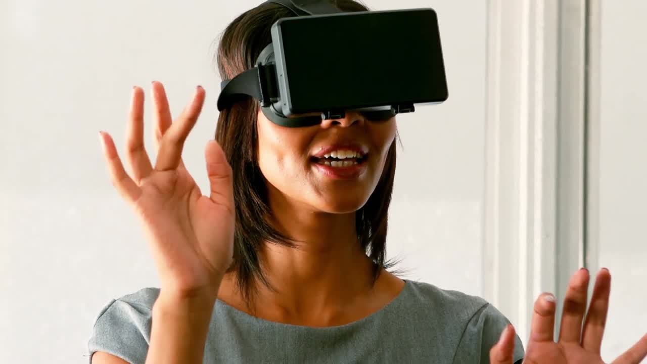 Female business executive using virtual glasses