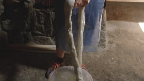 squeezing out liquid by hand, tenili cheese making, chobareti georgia