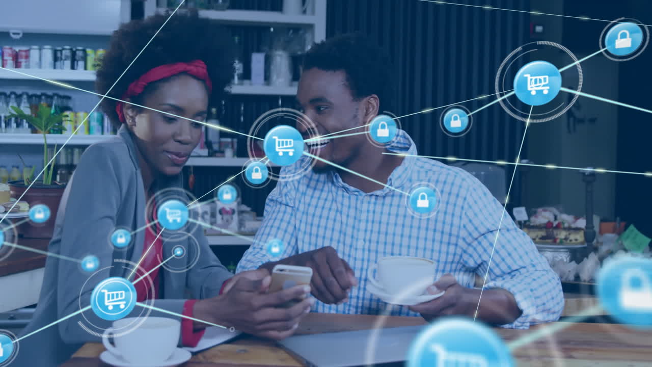 Animation of network of connections with shopping trolley icons over diverse people in cafe