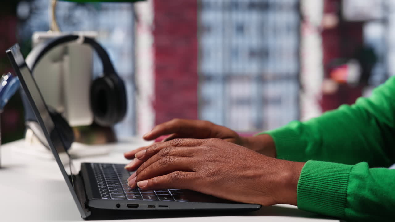 Vertical Video Freelancer creating articles content for his online blog at home desk