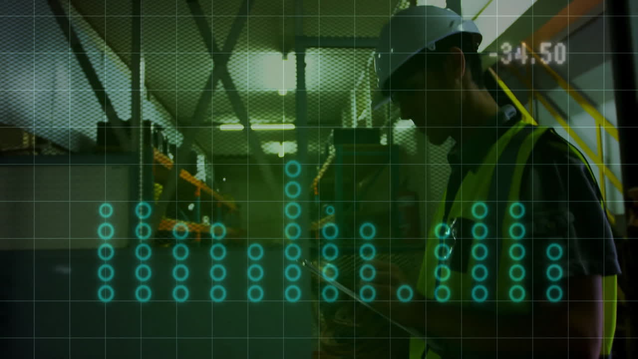 Technician holding tablet while analyzing glowing data nodes over grid overlay in industrial plant