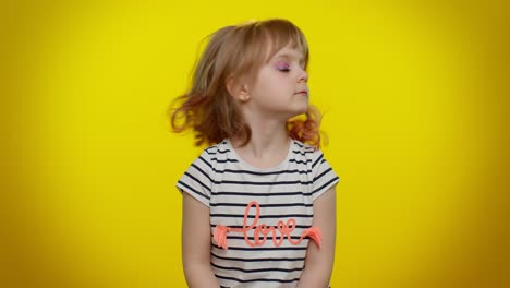 little girl in a striped shirt with the word love on it