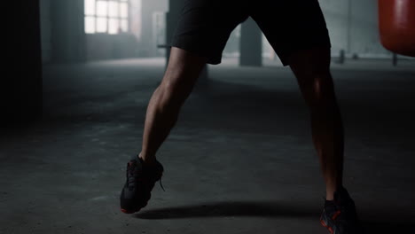 Man-actively-moving-during-training.-Boxer-boxing-with-punch-bag