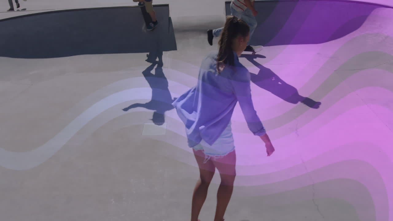 Female skateboarder riding concrete bowl under purple light overlay, showing sports design concept