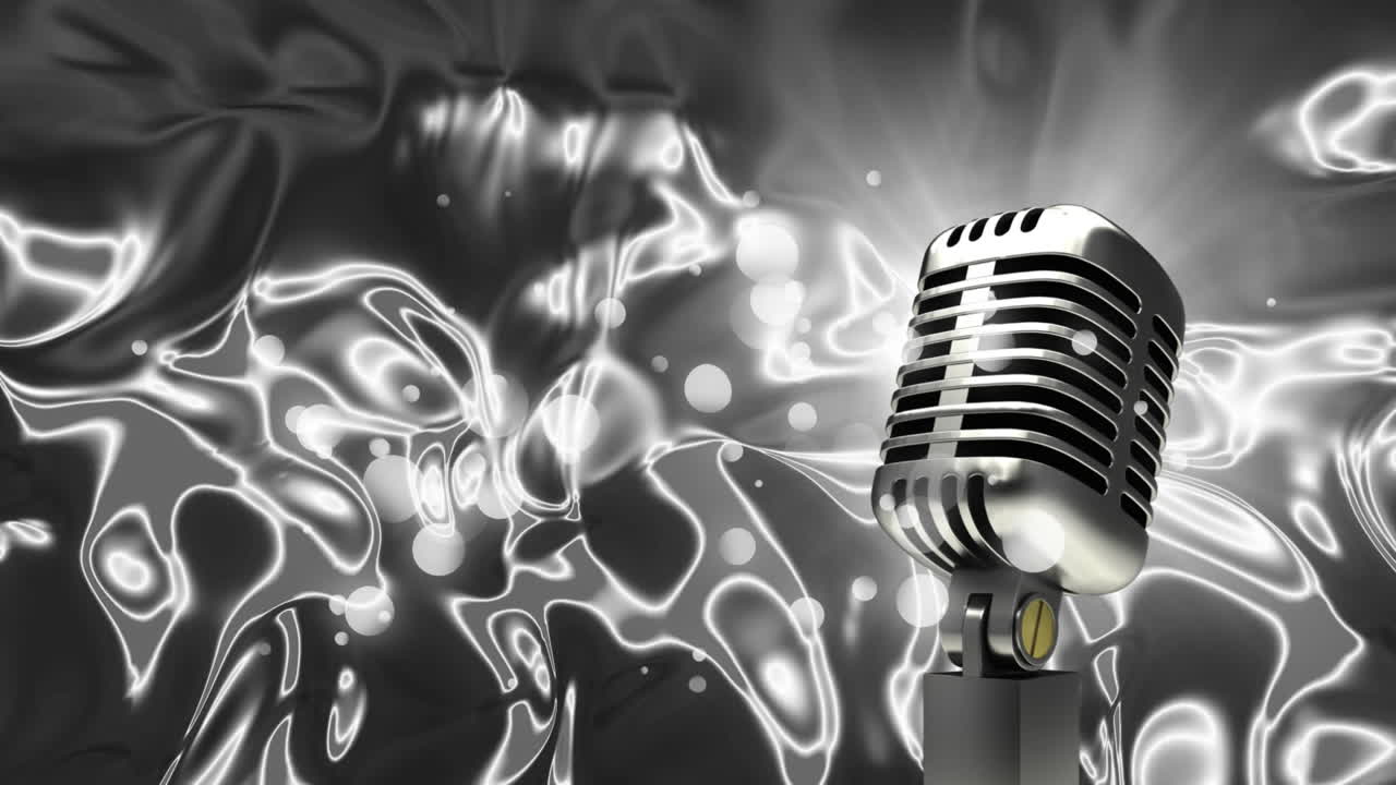 micrófono contra formas metálicas que se mueven en movimiento hipnótico