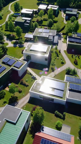 aerial view of a modern, sustainable residential community with solar panels on rooftops