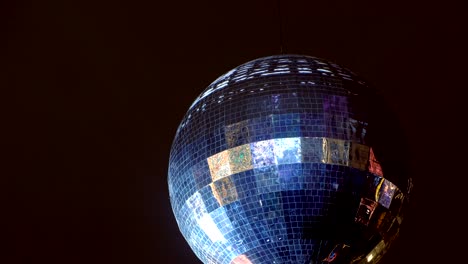 party lights disco ball, mirror ball on night dark sky background.