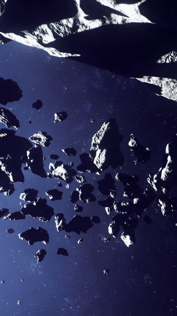 Asteroidi che fluttuano nello spazio con uno sfondo scuro che mostra profondità e distanza