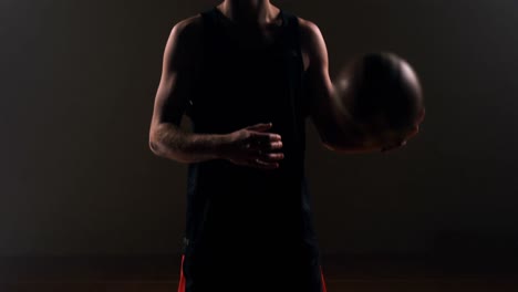 sportsman playing with basketball