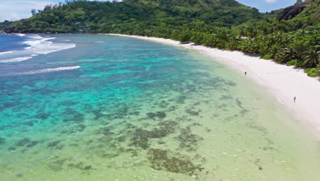 Flying-low-on-exotic-white-sanded-beach