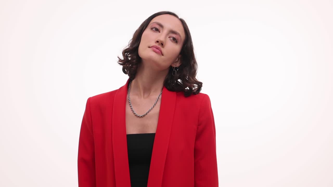 A woman in a red blazer displays various thoughtful and relaxed expressions