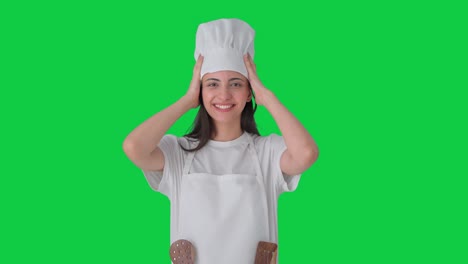 happy indian chef wearing hat green screen