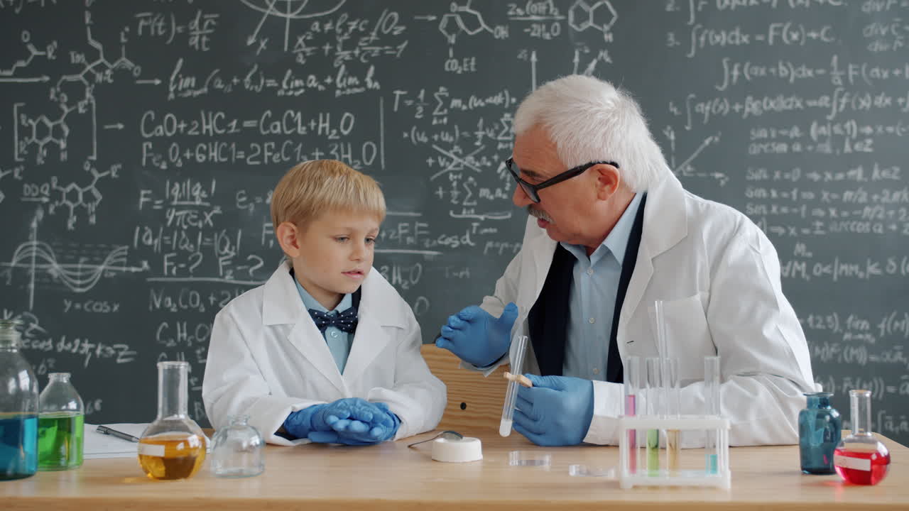 Science Teacher and Student in Chemistry Class