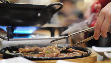 serving a dish in a korean restaurant