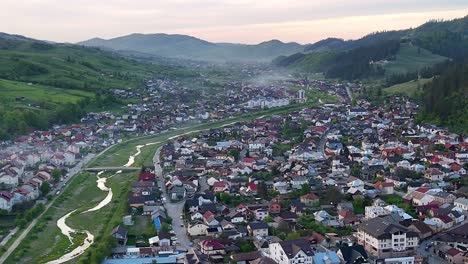 Gura-Humorului-and-Manastirea-Humorului-view-from-drone-at-sunset