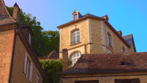 exterior of old and historic buildings in beynac, france. - low angle shot
